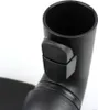 Close-up of a black vacuum cleaner attachment with a button. Produktbild-Vorschau