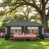 A family is having a picnic under a large tree, sheltered by a dark gray canopy tent. Voir les images du produit