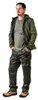 A man wearing work pants and a jacket, standing with his hands in his pockets. Anteprima dell’immagine prodotto