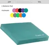 A teal balance pad is shown in the foreground, with a selection of colored circular pads above it. Produktbild-Vorschau