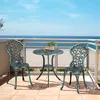 A bistro set on a balcony overlooking the ocean. Produktbild-Vorschau