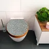 A toilet with a decorative seat in a bathroom. Produktbild-Vorschau