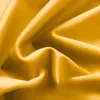 A close-up shot of draped mustard yellow fabric, likely velvet or a similar soft material, showing its texture and folds. Produktbild-Vorschau