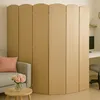 A room divider is placed next to a sofa and a small table with flowers, with a desk and computer visible in the background. Náhľad obrázku produktu