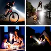Collage of four images showing a flashlight being used in different scenarios: cycling at dusk, walking a dog at night, reading a book indoors, and camping. Anteprima dell’immagine prodotto