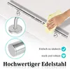 A hand is cleaning a stainless steel handrail with a yellow cloth. Close-up views of the handrail's mounting bracket and end cap are shown. Náhled obrázku produktu