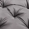 A close-up view of a tufted gray cushion. Produktbild-Vorschau