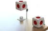 Two white power cubes with red outlets are shown on a wooden surface, one elevated by a cable and mount. Produktbild-Vorschau