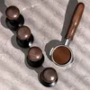 Coffee accessories laid out on a textured surface. Náhled obrázku produktu