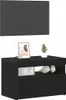 A black TV cabinet with a shelf and a drawer, decorated with a framed picture and a small plant on top. Podgląd zdjęcia produktu