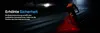 A cyclist riding a bike at night with a red light illuminating the ground around the rear wheel. Náhled obrázku produktu