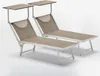 Two beach chairs with canopies on a plain background. Anteprima dell’immagine prodotto