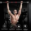 A muscular man is performing a pull-up on a doorway pull-up bar in a gym setting. Below the man are four circular icons with text. Produktbild-Vorschau