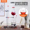 A laboratory distillation setup for essential oil production, with accompanying text and graphics. Produktbild-Vorschau