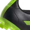 Close-up of the heel and sole of a black and green soccer cleat. Náhled obrázku produktu