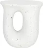 A white speckled side table with a U-shaped opening. Náhled obrázku produktu