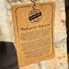 A close-up of a product tag with text in multiple languages. Voir les images du produit