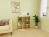 A living room scene featuring a cube shelf filled with decorative items, next to a sofa and a window with curtains. Náhľad obrázku produktu