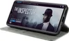 A smartphone in a flip case is displayed, showing a movie streaming interface on its screen. Produktbild-Vorschau