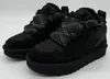 A pair of black UGG women's sneakers with plaid accents and thick soles, displayed against a white background. Produktbild-Vorschau