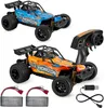 Two remote-controlled cars, one blue and one orange, are displayed with their accessories, including batteries and a remote control. Anteprima dell’immagine prodotto
