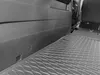 The image shows the interior of a vehicle, specifically the cargo area, with a black rubber floor mat installed. Produktbild-Vorschau