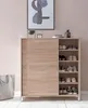 A shoe cabinet with sliding doors and open shelves displaying shoes, placed against a pink wall. Produktbild-Vorschau