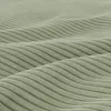 A close-up view of a green corduroy fabric with a wavy texture. Produktbild-Vorschau