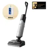 A cordless stick vacuum cleaner with a bottle of cleaning solution and a warranty badge. Produktbild-Vorschau