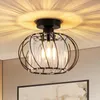 A close-up shot of a black metal and crystal ceiling light fixture, casting a patterned light on the ceiling. Produktbild-Vorschau