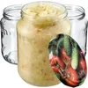 Three glass jars, one filled with sauerkraut, and a decorative overlay of tomatoes and cucumbers. Anteprima dell’immagine prodotto
