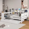 A white daybed with a pull-out trundle bed, integrated desk, and shelving unit in a bedroom setting. Produktbild-Vorschau