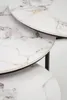 A close-up view of three nesting tables with a marble-like pattern. Produktbild-Vorschau