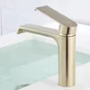 A close-up shot of a modern brushed gold faucet over a bathtub filled with water. Náhľad obrázku produktu