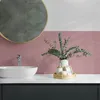 A bathroom vanity with a sink, faucet, and decorative items. Podgląd zdjęcia produktu