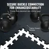 Several black kettlebells are placed on a dark, speckled floor mat. In the foreground, interlocking puzzle pieces of the floor mat are visible, with text highlighting the 'Secure Buckle Connection' and 'Tightly Closed Buckles'. Produktbild-Vorschau