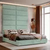 A bedroom scene featuring a bed with a large upholstered headboard. Anteprima dell’immagine prodotto