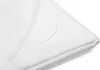 A close-up view of a folded white mattress protector. Produktbild-Vorschau