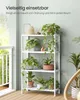 A white shelving unit with multiple plants on a balcony. Produktbild-Vorschau