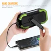A hand is holding a solar hand crank charger and connecting it to a smartphone. Podgląd zdjęcia produktu