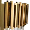 A close-up view of a gold and crystal chandelier. Produktbild-Vorschau