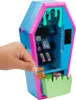 A hand is holding a miniature bag of snacks in front of a toy vending machine shaped like a coffin. Náhľad obrázku produktu