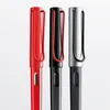 Three fountain pens in different colors (red, black, and silver) are lined up against a white background. Produktbild-Vorschau