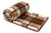 A rolled-up plaid blanket on a white background. Produktbild-Vorschau