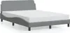 A gray fabric bed frame with a white mattress on a white background. Produktbild-Vorschau