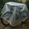 A bicycle covered with a transparent tarp in the rain. Anteprima dell’immagine prodotto