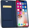 A blue flip case for an iPhone XR is shown open, with the phone displaying its home screen. Produktbild-Vorschau