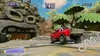 A racing game scene with a red truck on a track, a large stone head sculpture, and jungle foliage. Produktbild-Vorschau