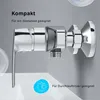 A close-up of a chrome faucet valve mounted on a wall, with text overlays highlighting its features. Produktbild-Vorschau