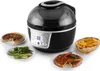 A black Klarstein VitAir Turbo air fryer is shown on a white background, surrounded by plates of food including a quiche, vegetables, fries, and a tortilla. Produktbild-Vorschau
